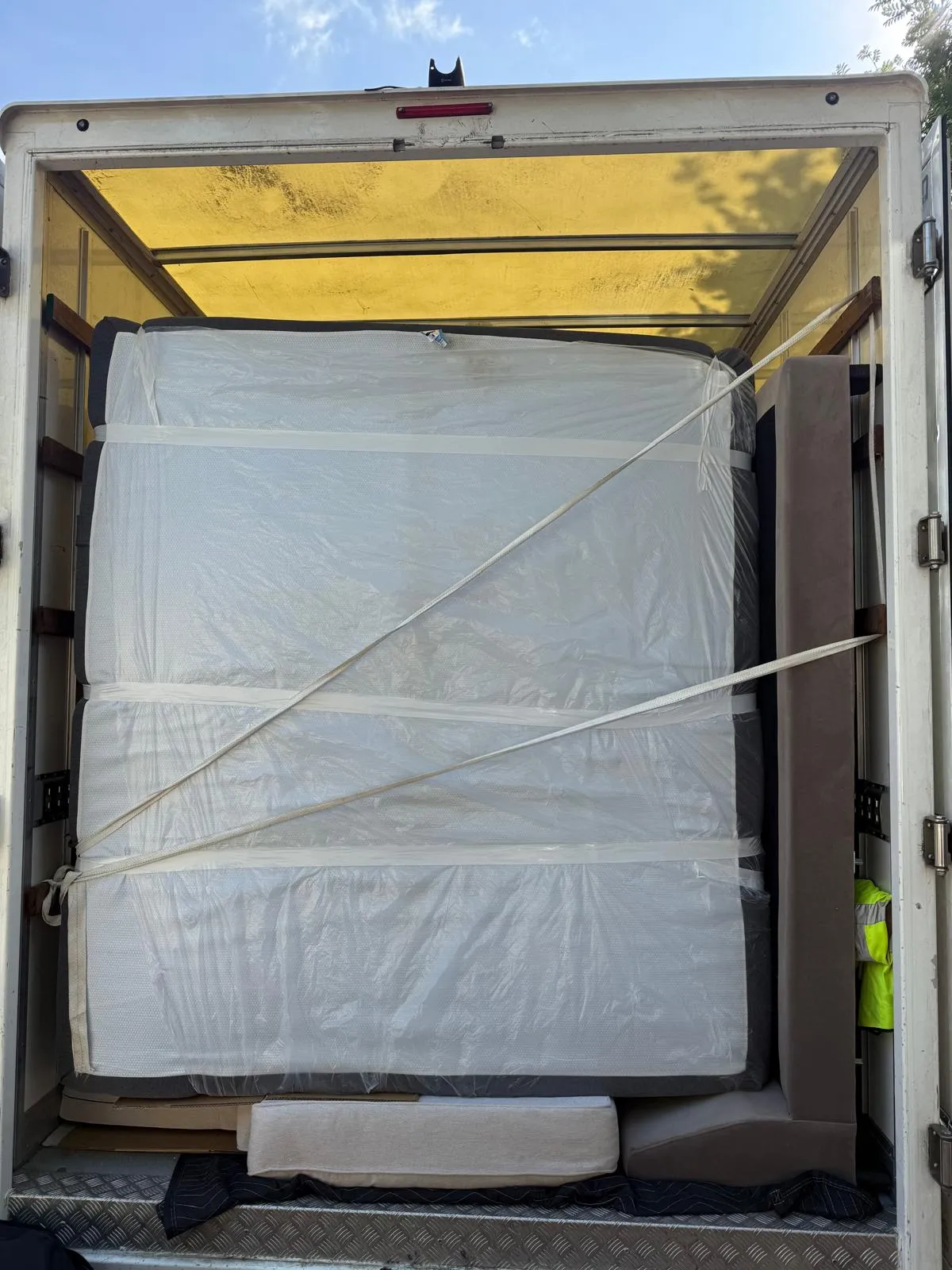 The open back of a loaded removal van